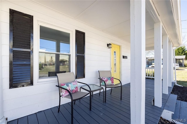 wooden terrace featuring a porch