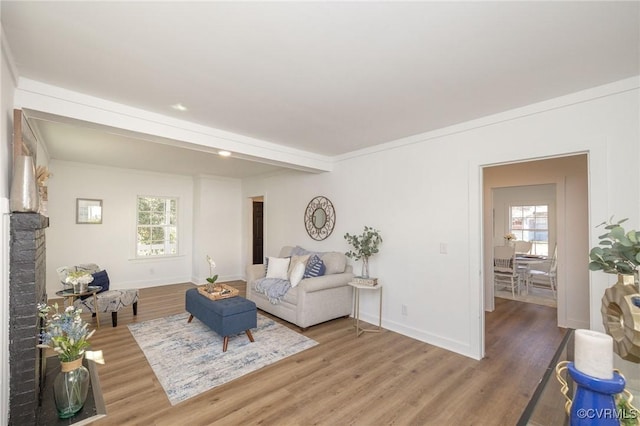 living room with light wood-style floors and baseboards
