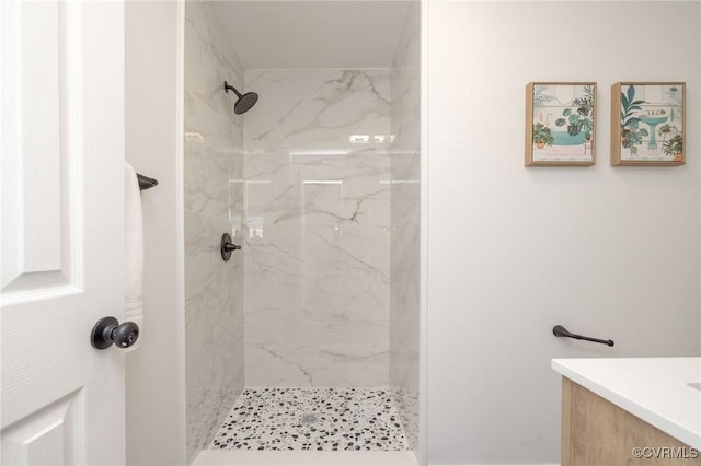 full bathroom with vanity and a shower stall