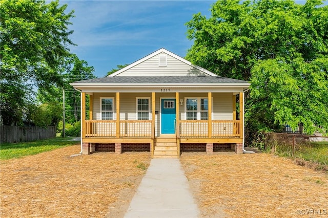 1217 Darbytown Rd, Richmond, VA 23231 - bungalow-style home featuring fence, a porch, and roof with shingles