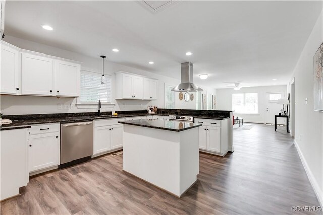 1217 Darbytown Rd, Richmond, VA 23231 - kitchen with a sink, appliances with stainless steel finishes, island range hood, and light wood-type flooring