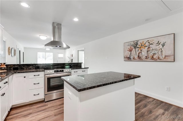 1217 Darbytown Rd, Richmond, VA 23231 - kitchen with extractor fan, dark stone counters, stainless steel electric range, white cabinets, and light wood-style flooring