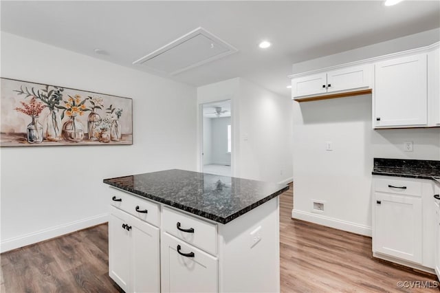 1217 Darbytown Rd, Richmond, VA 23231 - kitchen with dark stone counters, baseboards, and light wood-type flooring