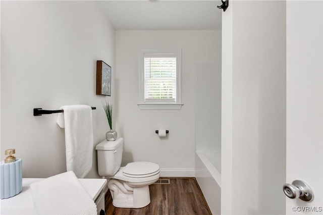 1217 Darbytown Rd, Richmond, VA 23231 - full bathroom featuring baseboards, wood finished floors, and toilet