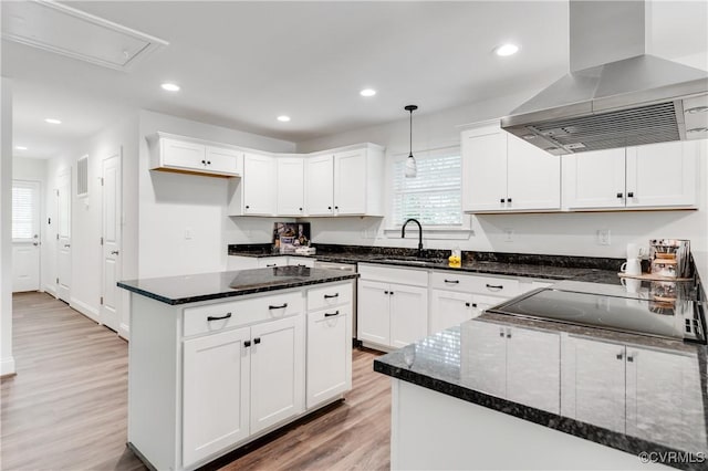 1217 Darbytown Rd, Richmond, VA 23231 - kitchen featuring plenty of natural light, a sink, light wood-style floors, and exhaust hood