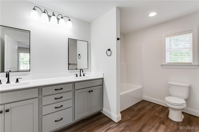 1217 Darbytown Rd, Richmond, VA 23231 - full bath with a sink, baseboards, toilet, and wood finished floors