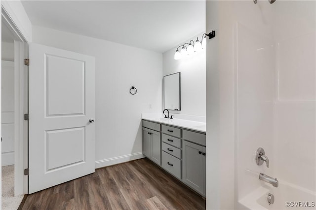 1217 Darbytown Rd, Richmond, VA 23231 - full bath featuring a sink, double vanity, baseboards, bathing tub / shower combination, and wood finished floors