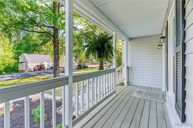 wooden terrace featuring a porch