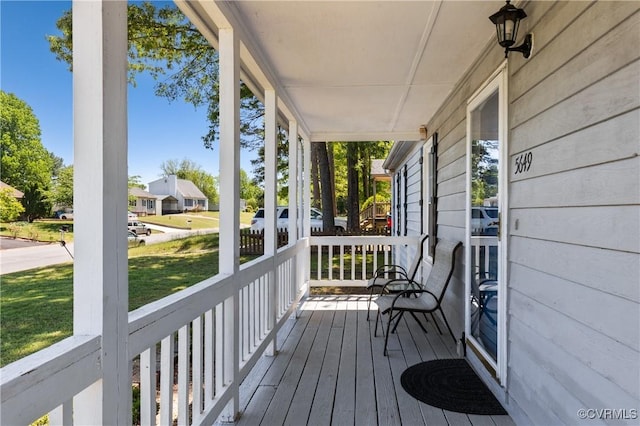 exterior space featuring a yard and covered porch