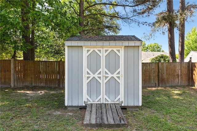 view of shed featuring a fenced backyard