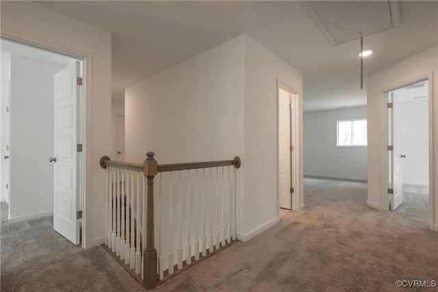 6081 Brickshire Dr, Providence Forge, VA 23140 - hall with baseboards, attic access, carpet, and an upstairs landing