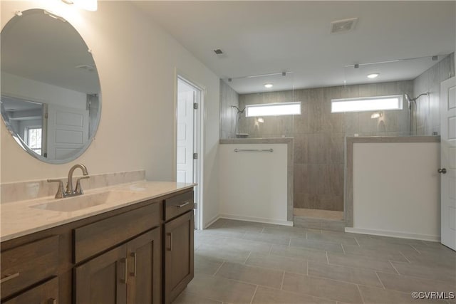 6081 Brickshire Dr, Providence Forge, VA 23140 - bathroom with a walk in shower, tile patterned flooring, vanity, and visible vents