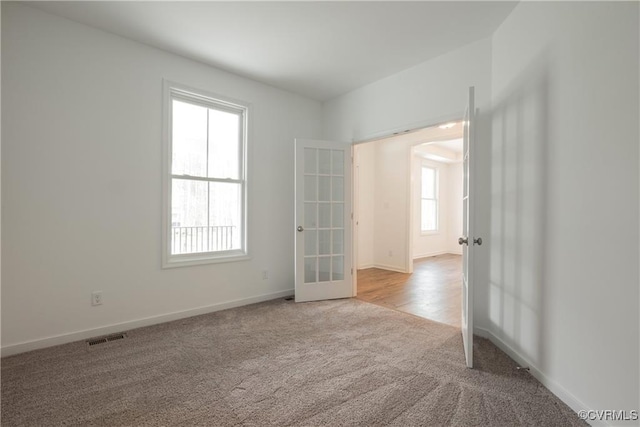 6081 Brickshire Dr, Providence Forge, VA 23140 - empty room with french doors, carpet flooring, baseboards, and visible vents