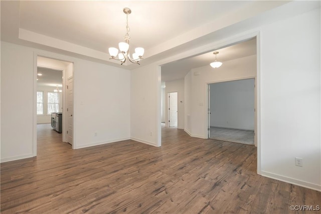 6081 Brickshire Dr, Providence Forge, VA 23140 - spare room with a raised ceiling, wood finished floors, and a chandelier