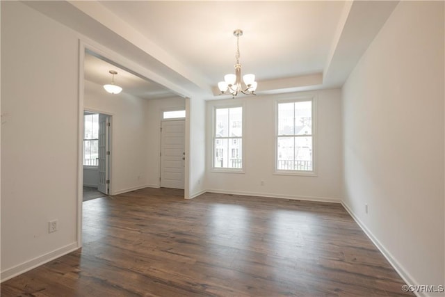 6081 Brickshire Dr, Providence Forge, VA 23140 - spare room featuring baseboards, a notable chandelier, dark wood finished floors, and a tray ceiling