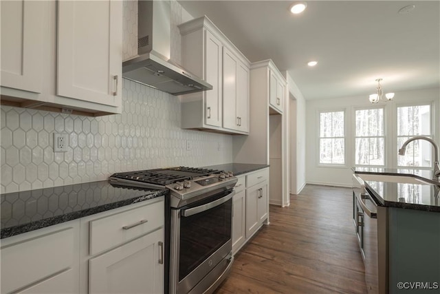 6081 Brickshire Dr, Providence Forge, VA 23140 - kitchen featuring a sink, stainless steel gas range oven, a chandelier, wall chimney exhaust hood, and dark wood-style floors