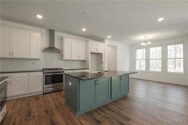 6081 Brickshire Dr, Providence Forge, VA 23140 - kitchen with an inviting chandelier, decorative backsplash, dark countertops, wall chimney exhaust hood, and gas stove
