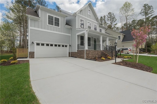 6081 Brickshire Dr, Providence Forge, VA 23140 - craftsman-style home featuring a front lawn, a garage, board and batten siding, covered porch, and driveway