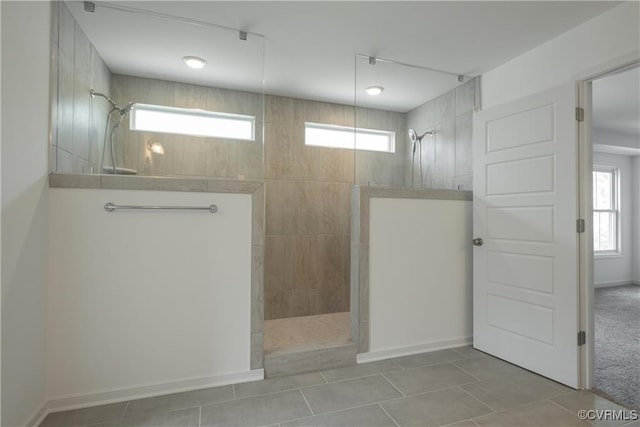 6081 Brickshire Dr, Providence Forge, VA 23140 - bathroom featuring a healthy amount of sunlight, a walk in shower, and tile patterned floors