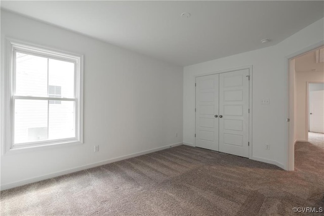 6081 Brickshire Dr, Providence Forge, VA 23140 - unfurnished bedroom featuring baseboards, carpet flooring, and a closet