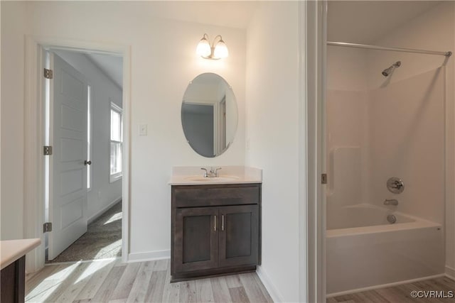 6081 Brickshire Dr, Providence Forge, VA 23140 - full bath with baseboards, shower / bath combination, wood finished floors, and vanity