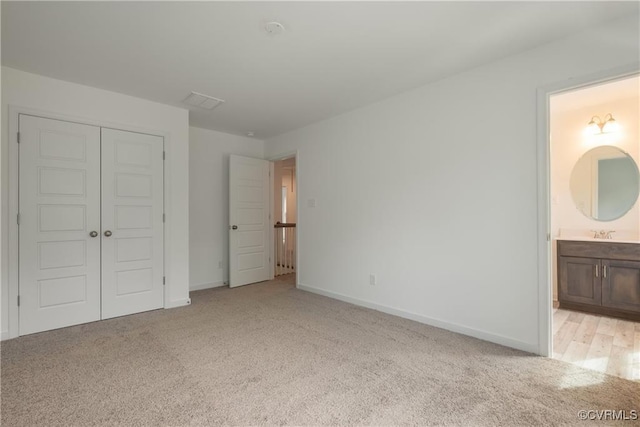 6081 Brickshire Dr, Providence Forge, VA 23140 - unfurnished bedroom with baseboards, ensuite bath, light carpet, and a closet