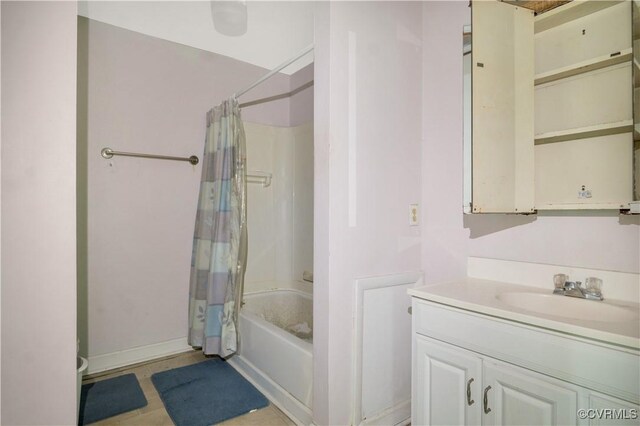 full bath with vanity, baseboards, and shower / tub combo with curtain