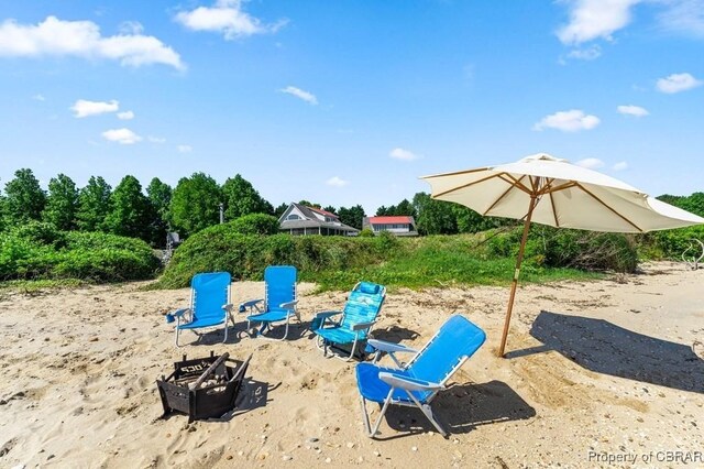 view of jungle gym with an outdoor fire pit