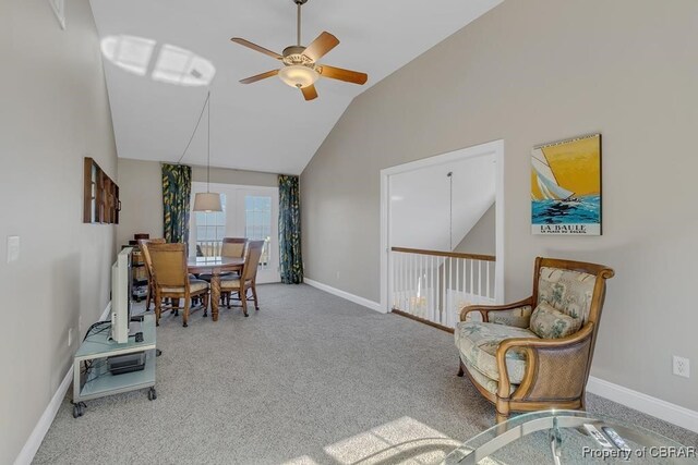 dining area with carpet floors, baseboards, high vaulted ceiling, french doors, and a ceiling fan