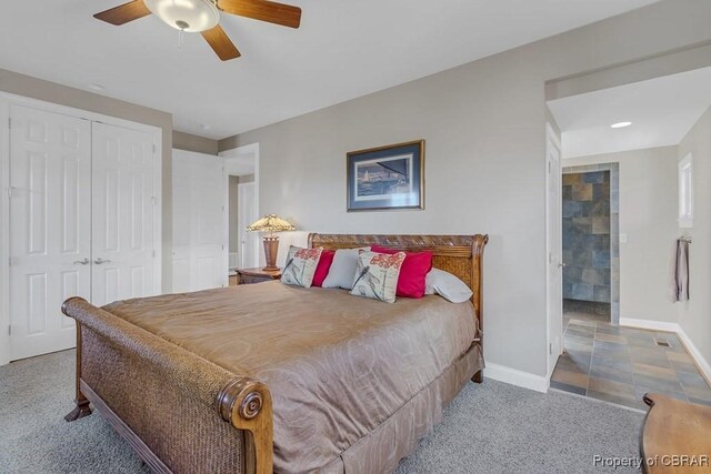 carpeted bedroom with baseboards, ceiling fan, and a closet