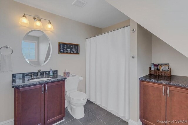 bathroom featuring tile patterned flooring, vanity, toilet, baseboards, and visible vents