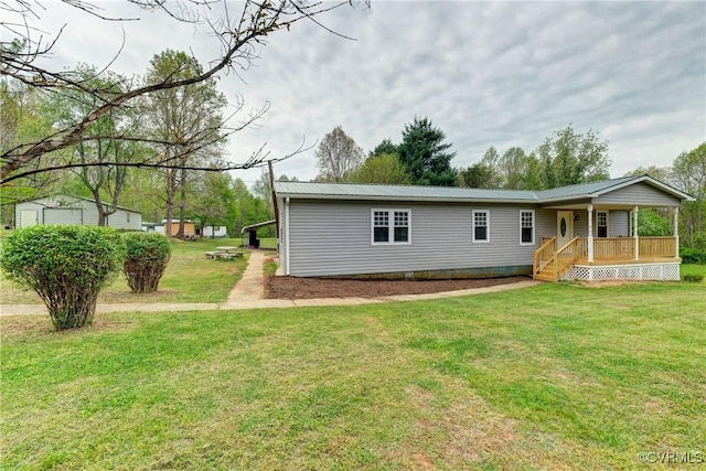 343 Liberty Rd, Buckingham, VA 23123 - rear view of property with a porch, metal roof, and a lawn