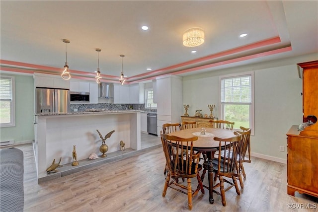 343 Liberty Rd, Buckingham, VA 23123 - dining room featuring a raised ceiling, light wood finished floors, healthy amount of natural light, and recessed lighting