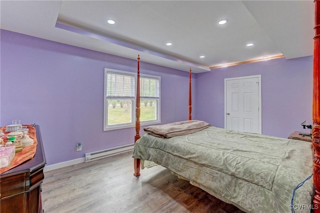 343 Liberty Rd, Buckingham, VA 23123 - bedroom featuring a baseboard heating unit, light wood-style floors, recessed lighting, and baseboards