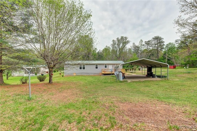 343 Liberty Rd, Buckingham, VA 23123 - view of grassy yard with a detached carport and a wooden deck