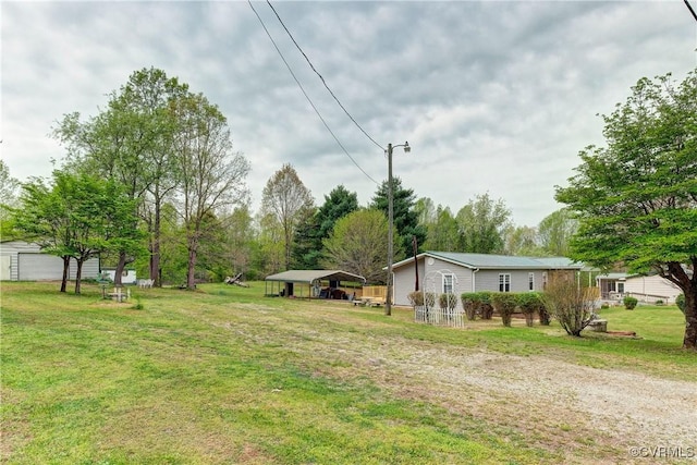 343 Liberty Rd, Buckingham, VA 23123 - view of green lawn featuring a detached carport