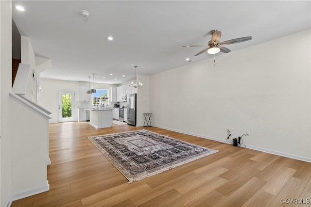 925 Scott Commons Ln, Henrico, VA 23227 - living room featuring recessed lighting, ceiling fan with notable chandelier, and light wood-type flooring