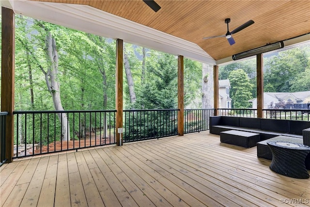 wooden terrace featuring ceiling fan and outdoor lounge area