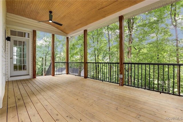 wooden deck with a ceiling fan