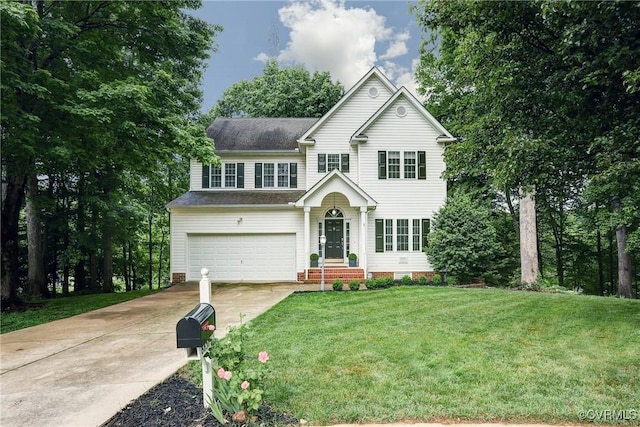 traditional-style home with driveway, an attached garage, a front lawn, and a shingled roof