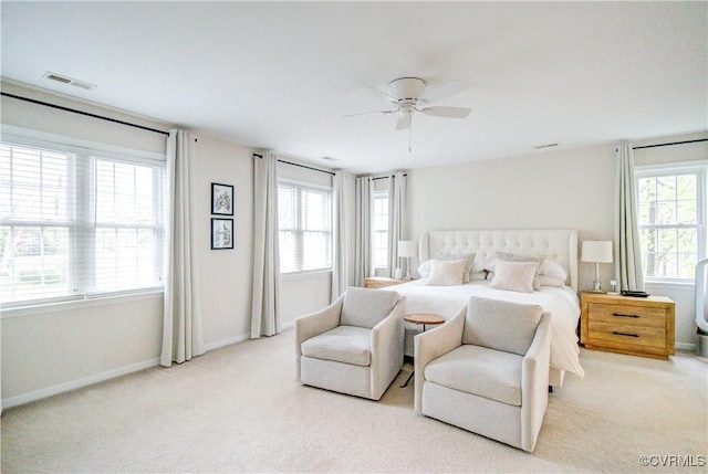 carpeted bedroom with baseboards and a ceiling fan