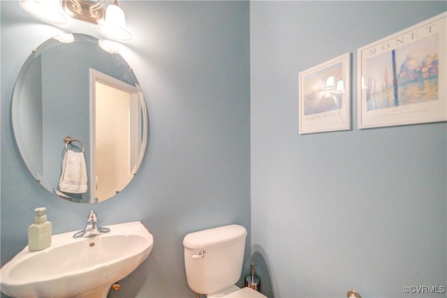 bathroom with a sink and toilet