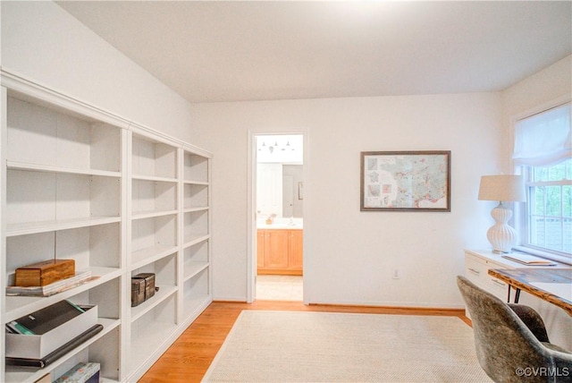 office space with light wood-type flooring