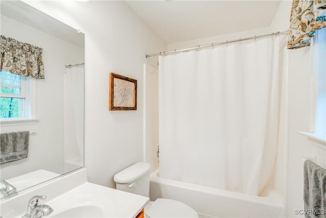 bathroom with vanity, toilet, and shower / tub combo with curtain