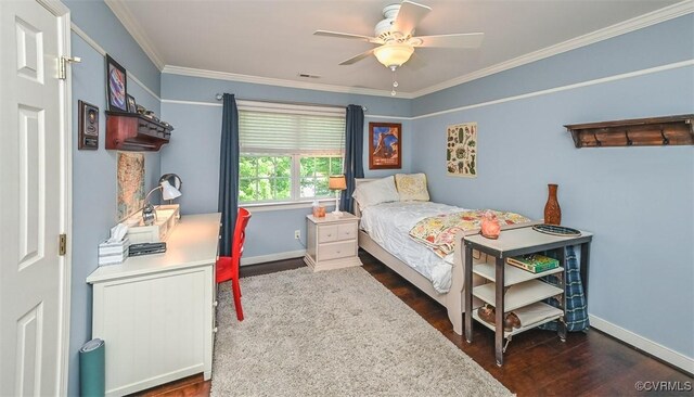 bedroom with crown molding, baseboards, and dark wood-type flooring