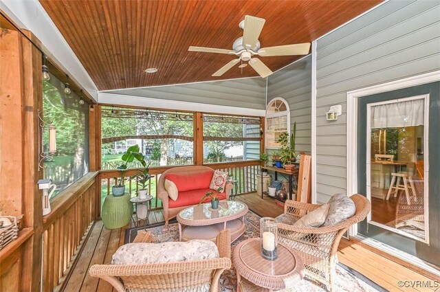sunroom / solarium with ceiling fan