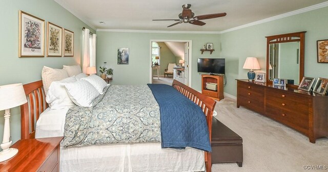 bedroom featuring ornamental molding, light carpet, and a ceiling fan