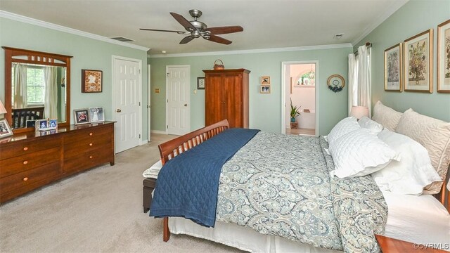 bedroom featuring light colored carpet, ornamental molding, a ceiling fan, and visible vents