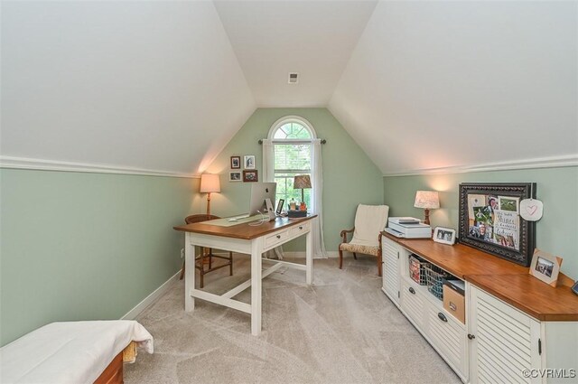 office space with baseboards, visible vents, light colored carpet, and lofted ceiling