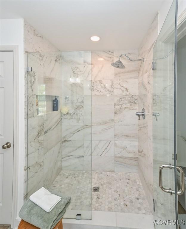 full bath with a shower stall